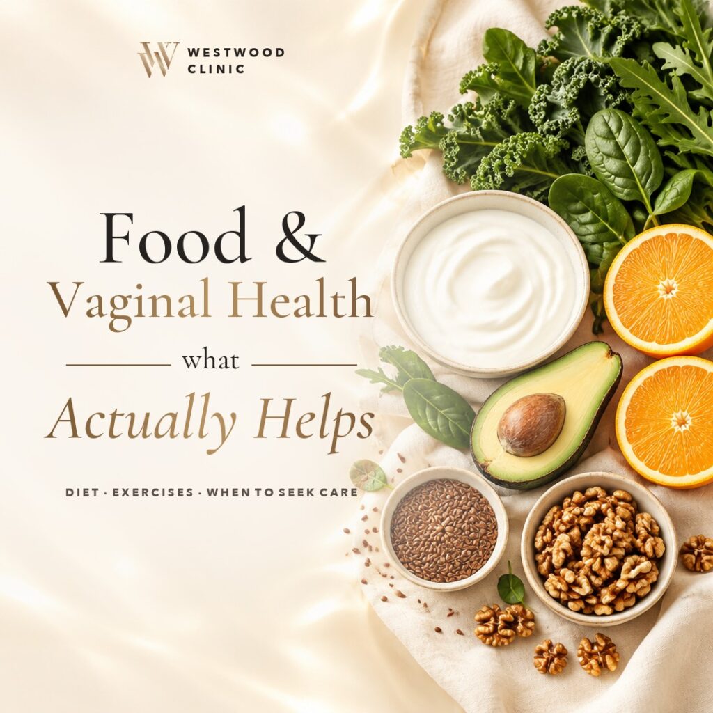 Fresh foods on cream linen: leafy greens, yoghurt, oranges and nuts